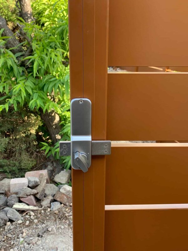 Brown Aluminum fence and pedestrian gate