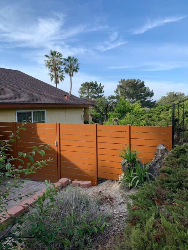 Brown Aluminum fence and pedestrian gate