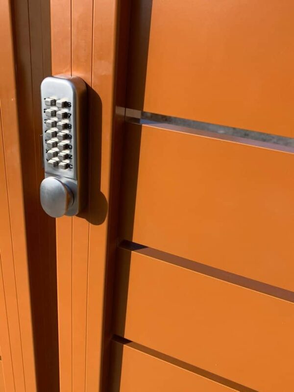 Brown Aluminum fence and pedestrian gate