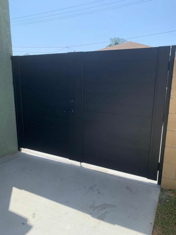 Double swing black driveway gates in Austin