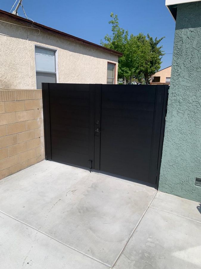 Double swing black driveway gates in Austin