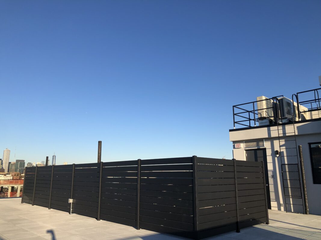 Aluminum fence on a rooftop in Brooklyn