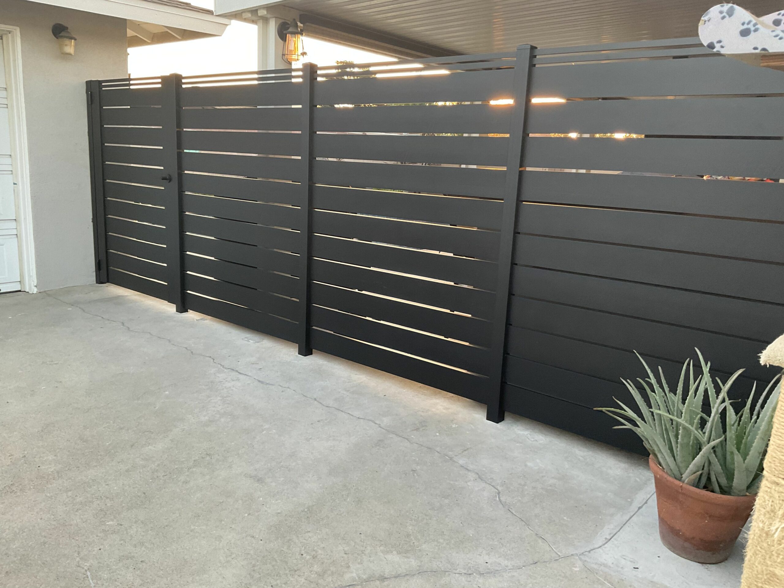 6' Fence and pedestrian gate on concrete slab in Plano, TX