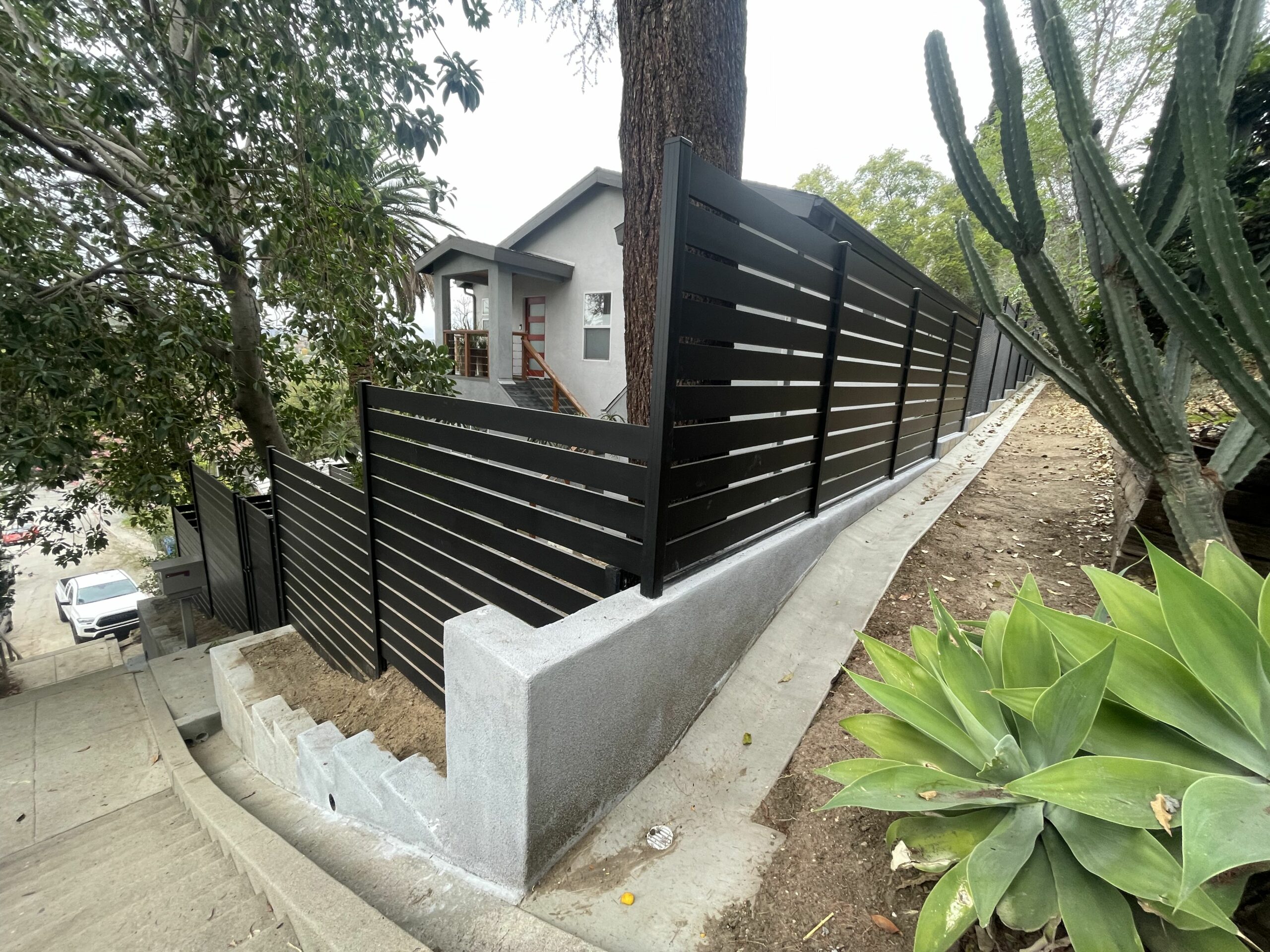 Horizontal aluminum fence on a stiff slope in Silver Lake, CA