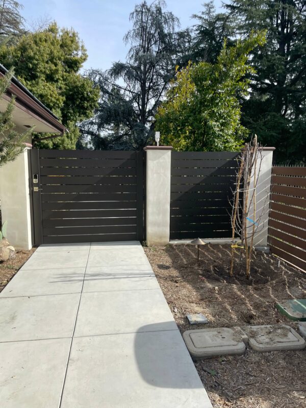 Bronze aluminum gate and fence panel from Alumission Modern Aluminum Fences & Gates