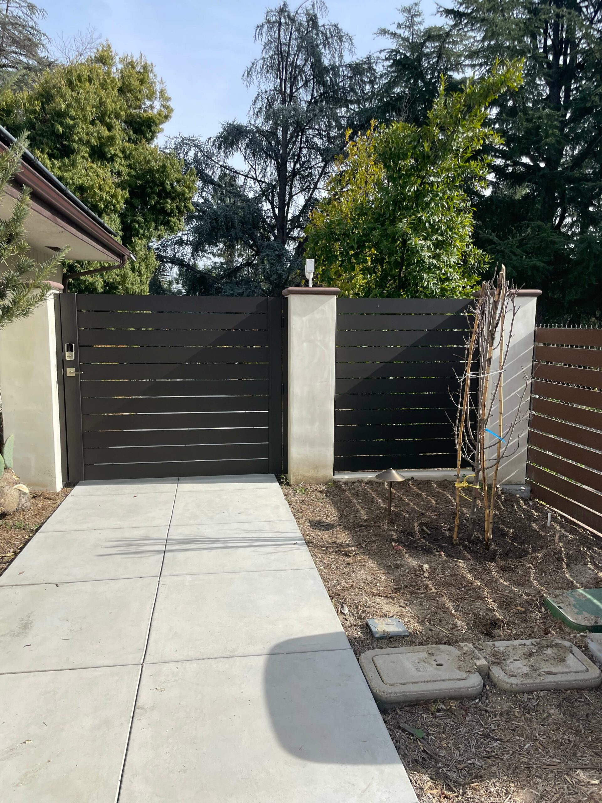 Bronze aluminum gate and fence panel from Alumission Modern Aluminum Fences & Gates