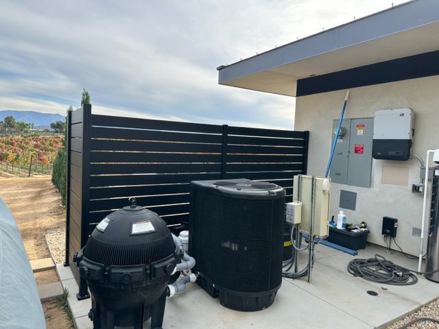 A/C Unit hidden by Black Aluminum Privacy Fence