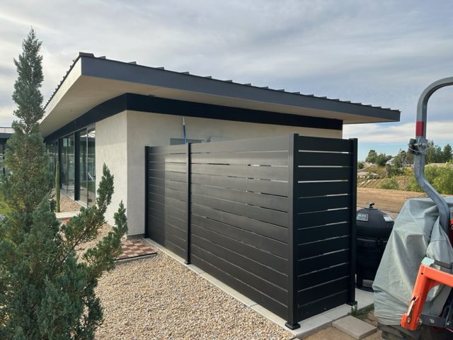 Black Aluminum Privacy Fence enclosing an A/C unit
