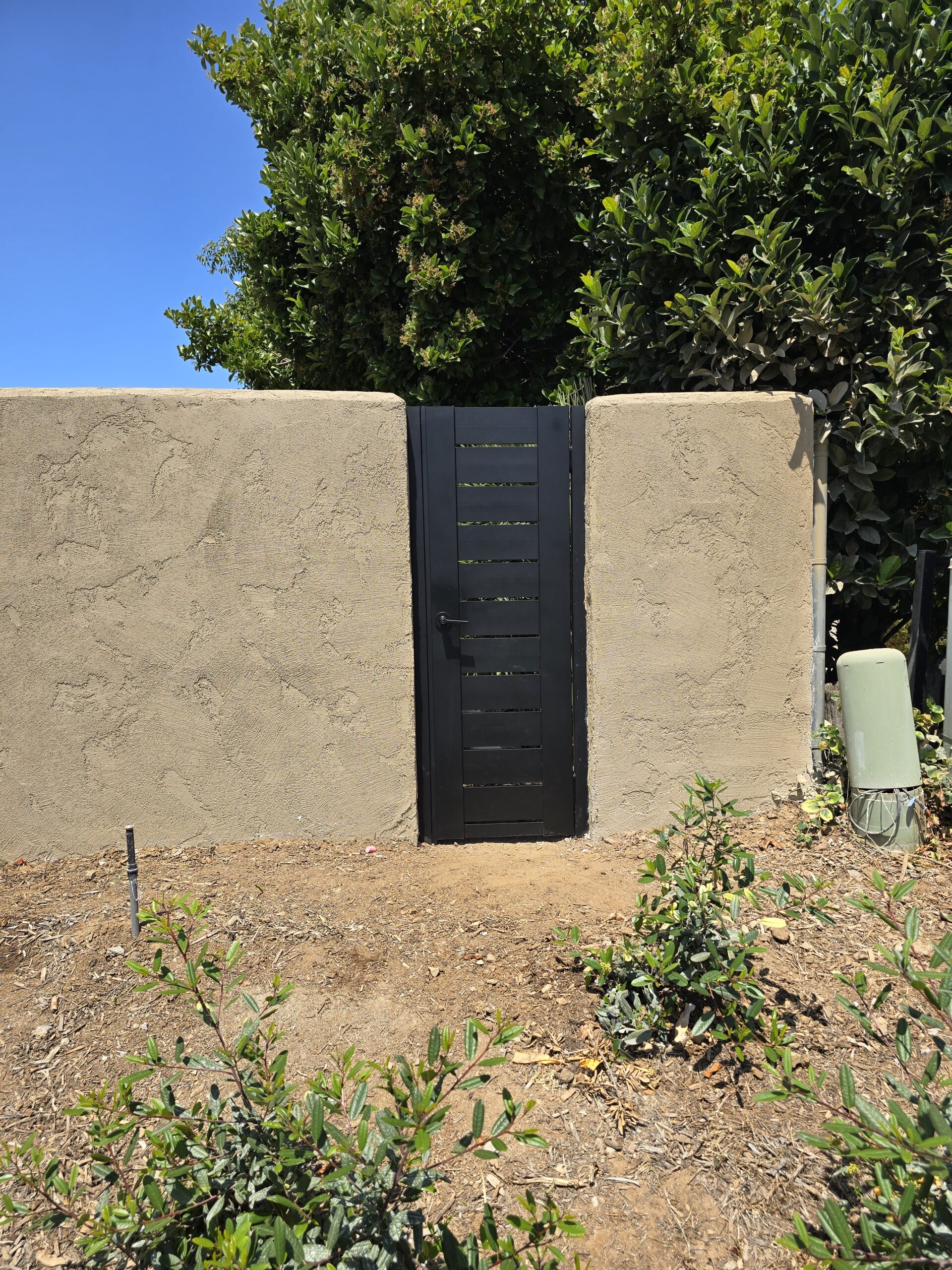 Pedestrian gate installed to existing perimeter walls
