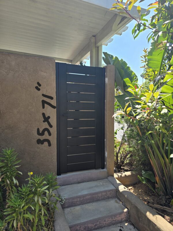 Pedestrian gate for outdoor gathering area