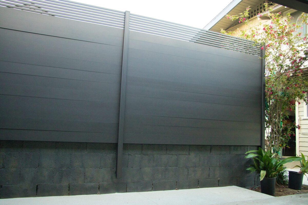 Tall Aluminum Bronze Fence Privacy Panels Installed In Residential Area