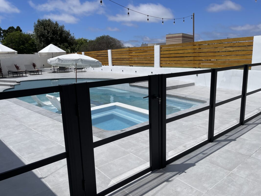 Custom Pool Enclosure with Clear Acrylic Panels Around A Pool