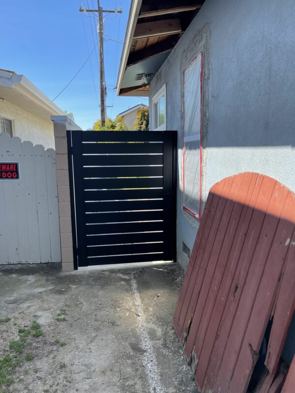 Aluminum Pedestrian Gate replacing old wooden gate.