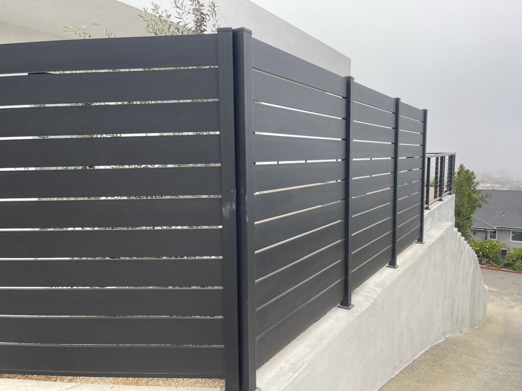Black Aluminum Panels and Fence installed around home