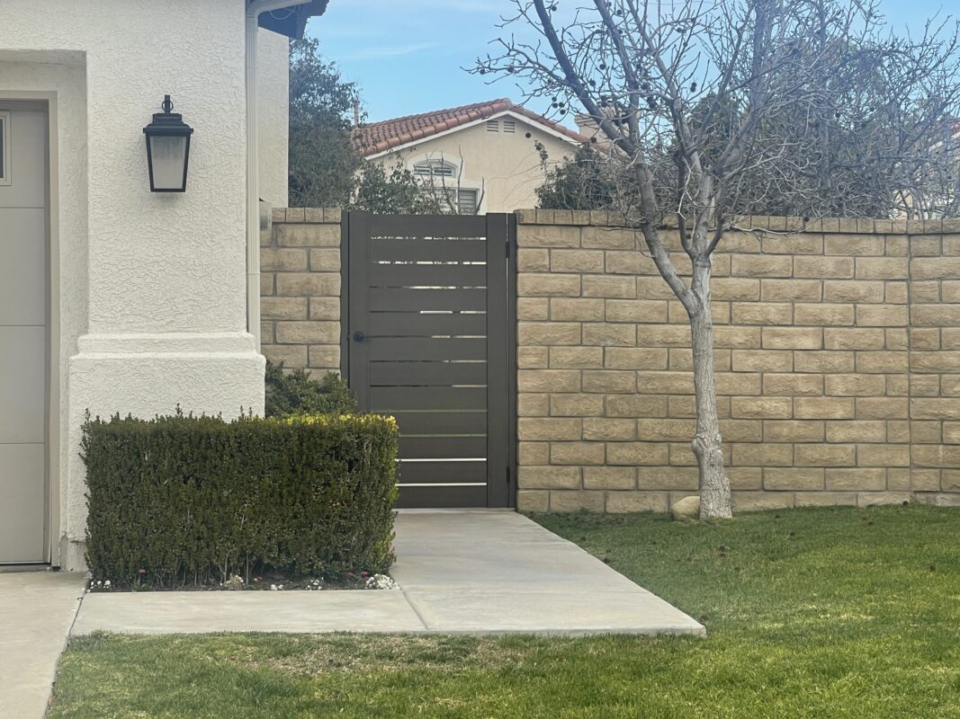 Tall Bronze Pedestrian Gate Side of Home between existing wall