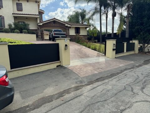 Modern sliding driveway gate installation enhancing property security and aesthetics.