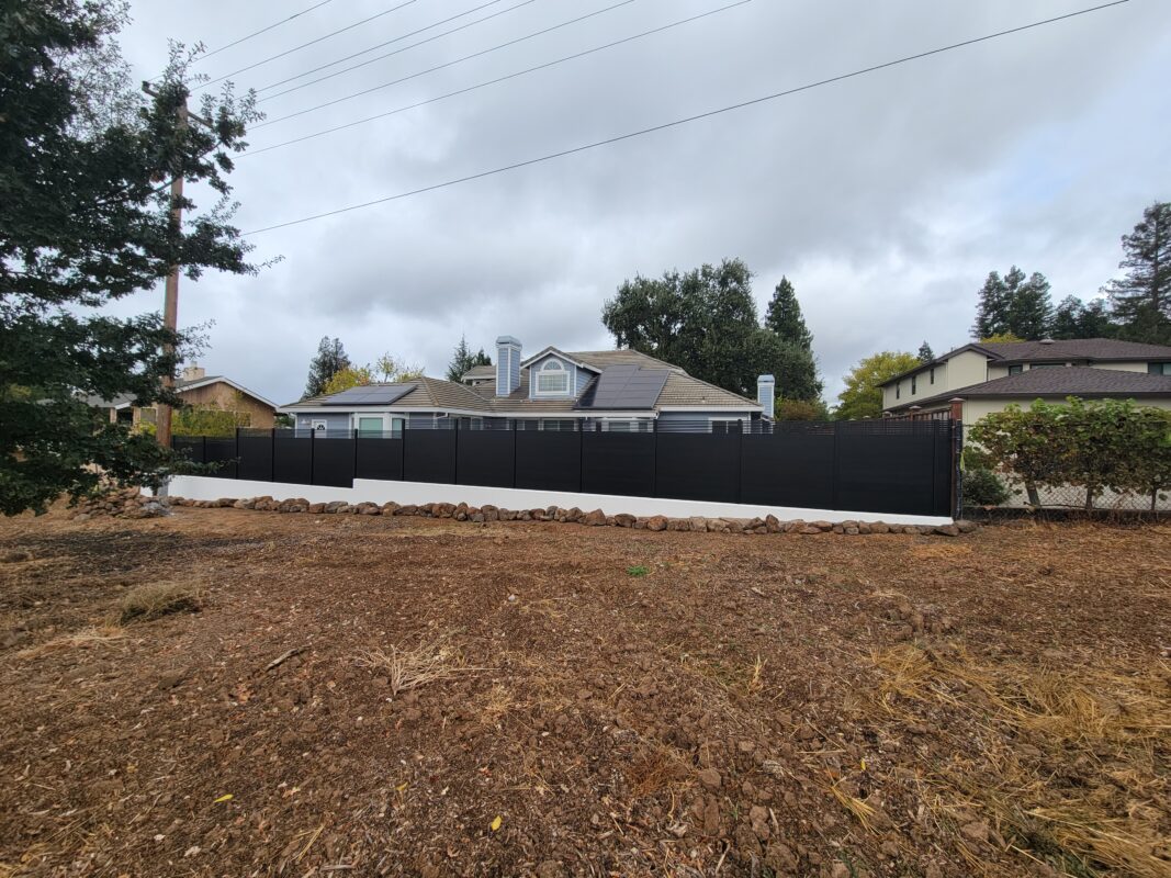 Black aluminum fence panels installed around a residential property in Walnut Creek, CA.