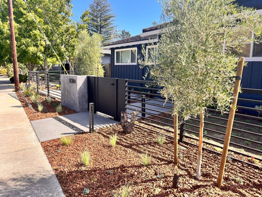 Modern black fence installation with landscaping in San Carlos, CA.