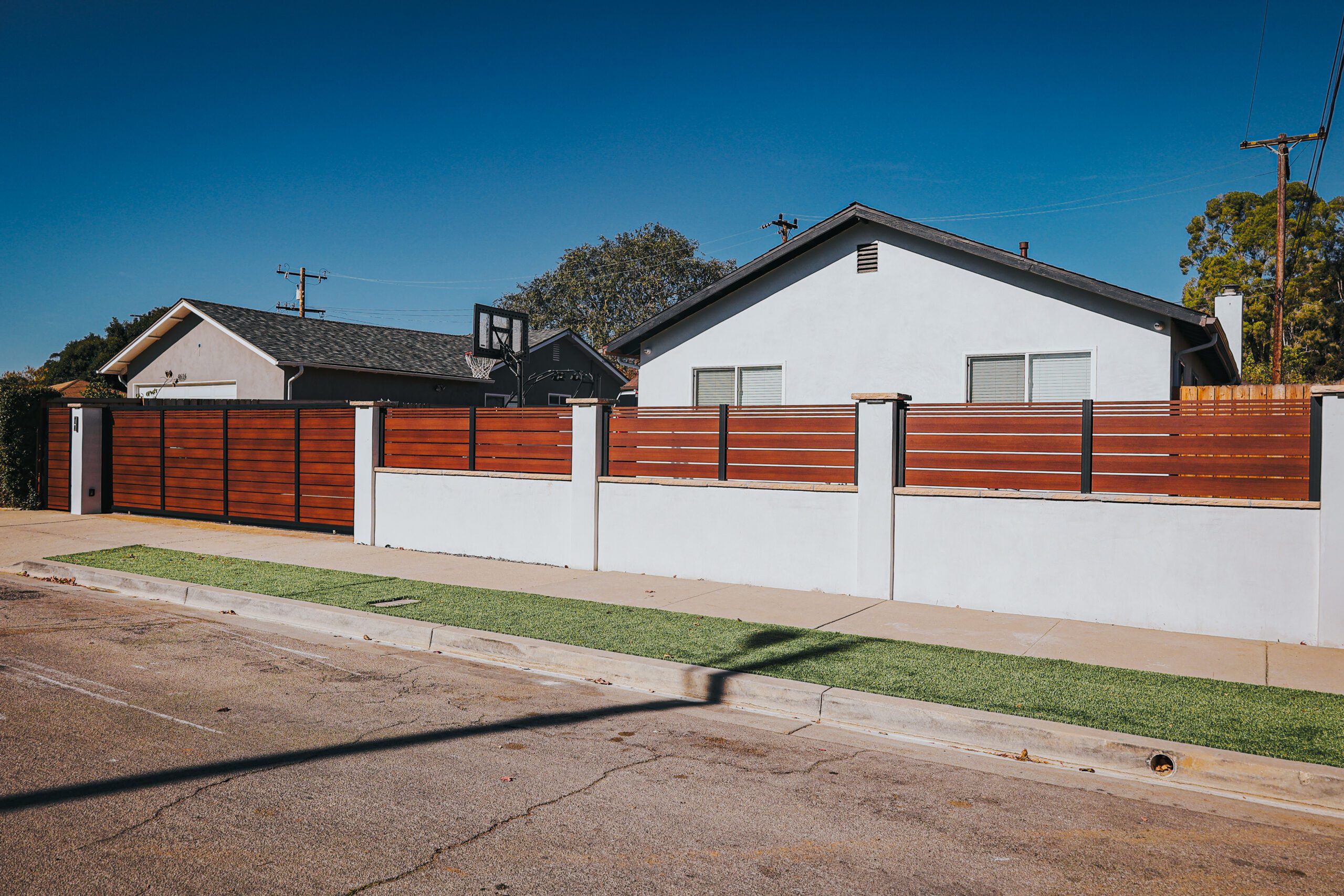 New aluminum fence and gate installation featuring a sleek, modern design.
