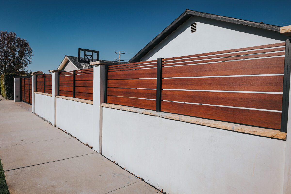 Modern aluminum fence resembling wood, enhancing property aesthetics in Santa Barbara.