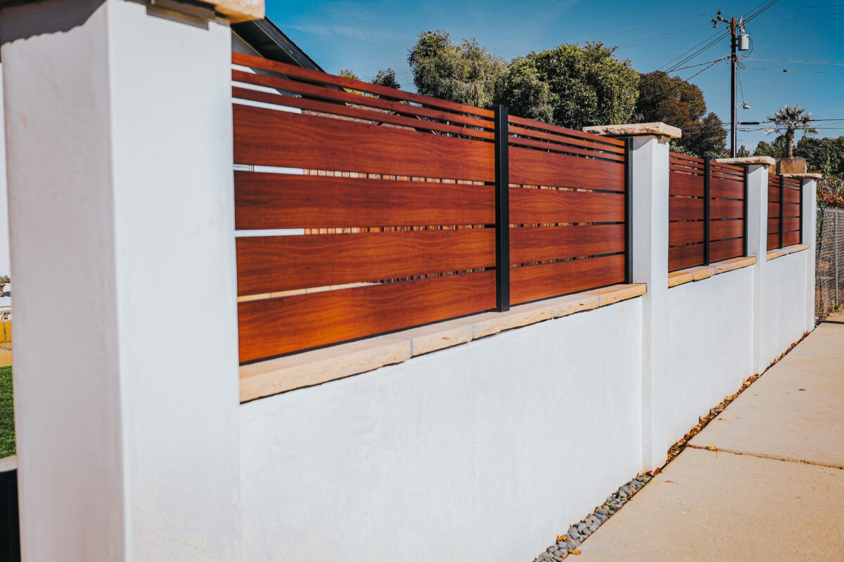 A modern aluminum fence mimicking wood, enhancing a property in Santa Barbara.