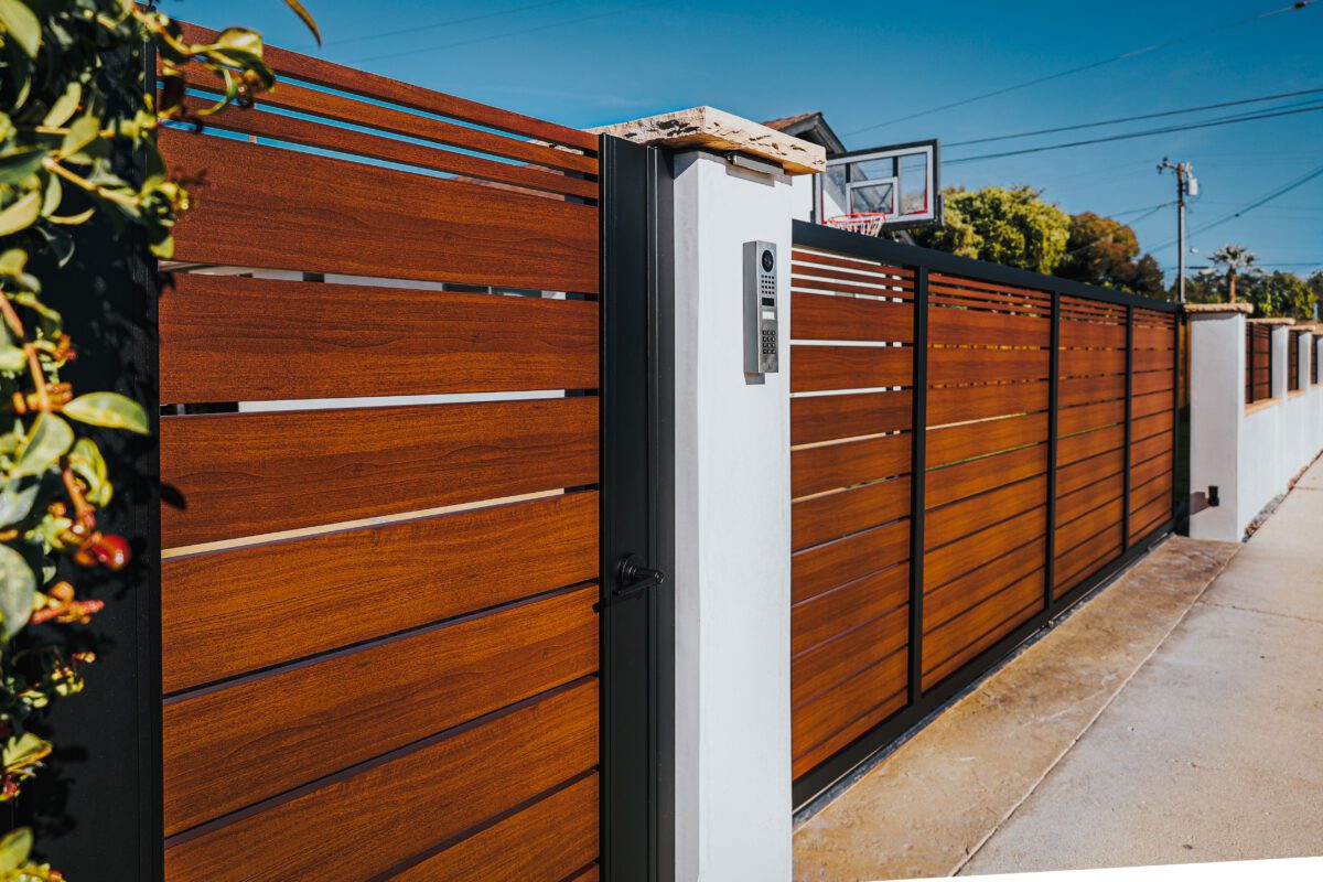 Aluminum fence installation showcasing a modern 'look like wood' design in Santa Barbara.