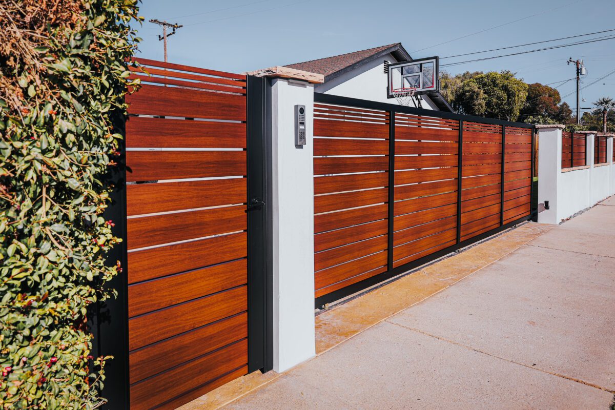 Modern aluminum fence with wood-like slats, enhancing curb appeal in Santa Barbara.