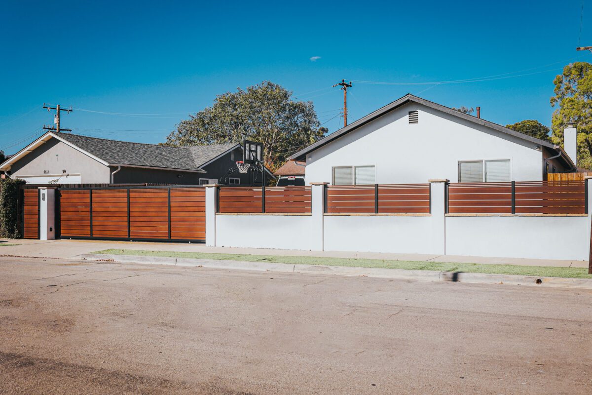 A modern aluminum fence resembling wood, enhancing a property in Santa Barbara.