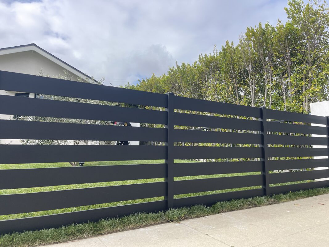Modern black aluminum fence installed, enhancing security and aesthetics in North Hollywood.