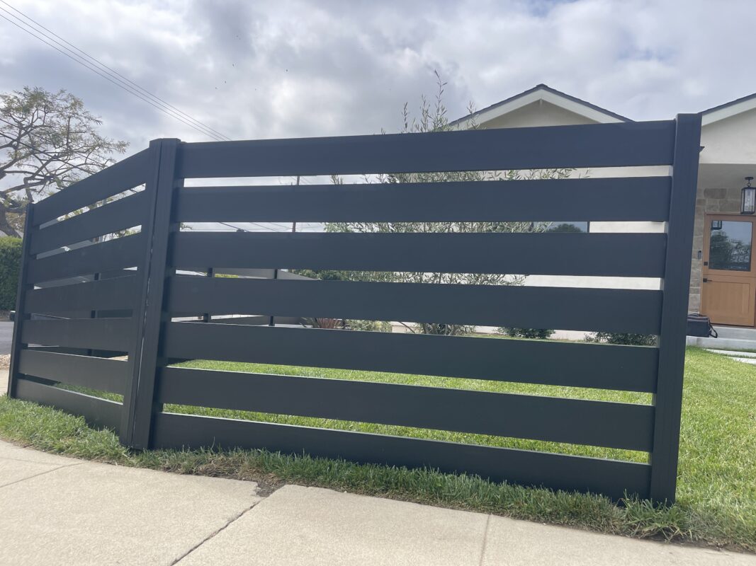 Modern black aluminum fence enhances curb appeal and security in North Hollywood.