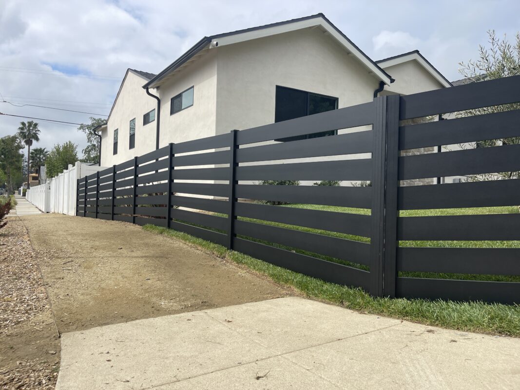 Modern black aluminum fence installed, enhancing curb appeal and security in North Hollywood.