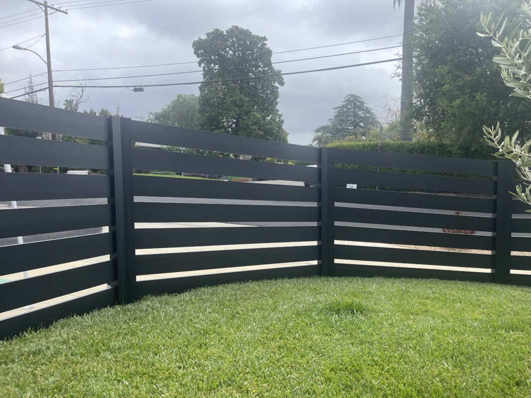 Modern black aluminum fence installed, enhancing aesthetics and security in North Hollywood.