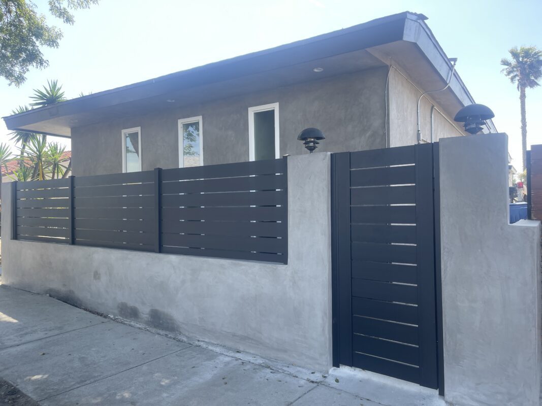 Modern aluminum fence installation enhancing property privacy and security.