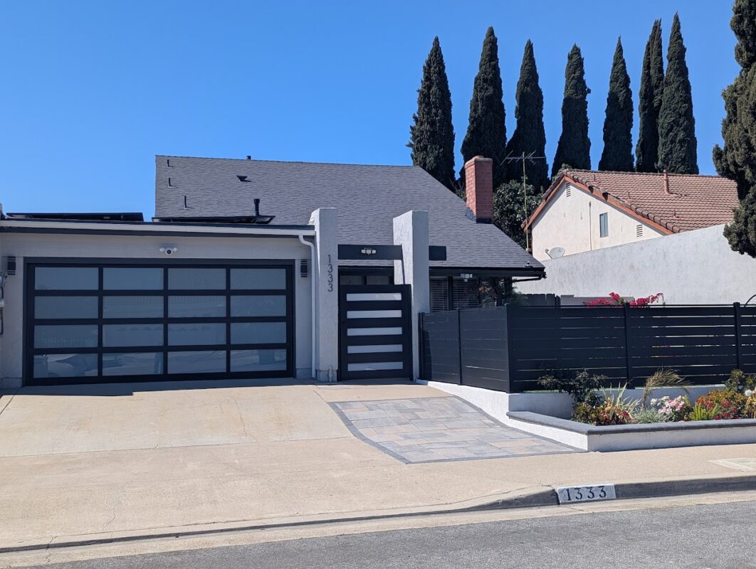 Modern home with a stylish black aluminum fence and gate in Santa Clara, CA.