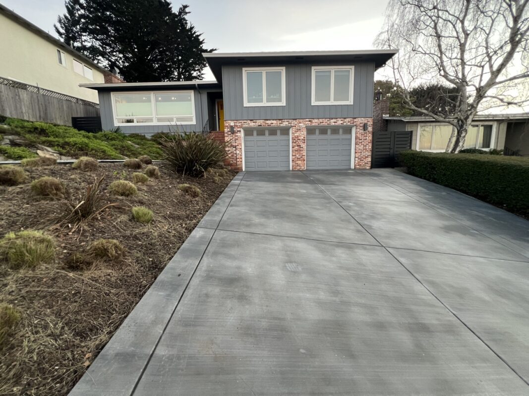 A newly installed black pedestrian gate complements a modern Bay Area home.