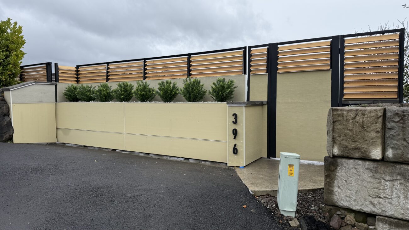Modern fence installation featuring a sleek design and greenery in Portland, OR.